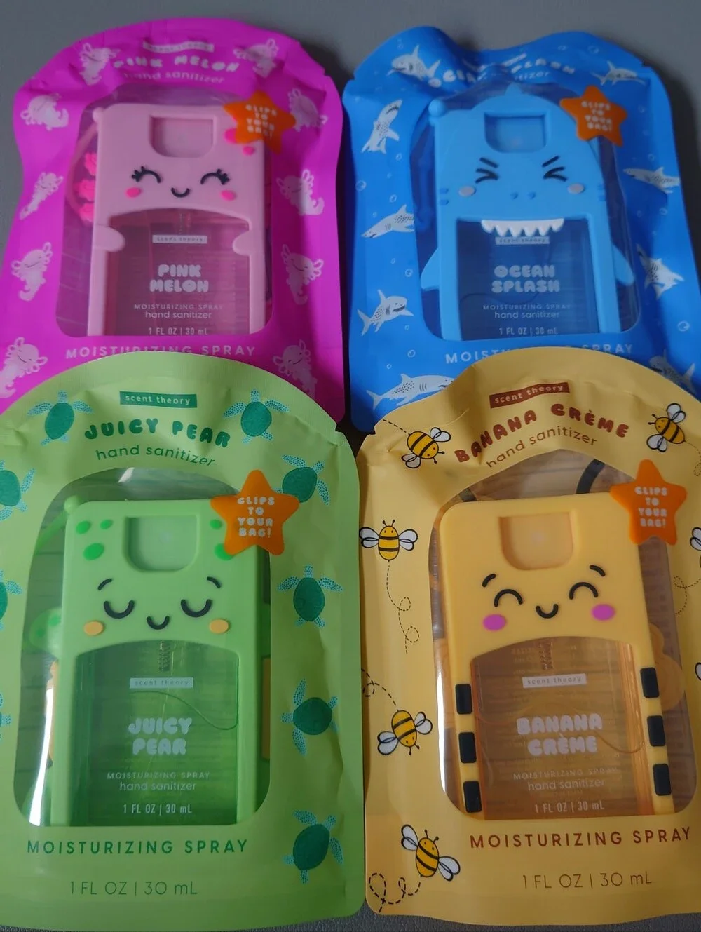 Scent Theory Hand Sanitizer 4 pack variety with reusable rubber cover design